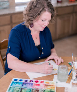 Adoptive mother painting with watercolor